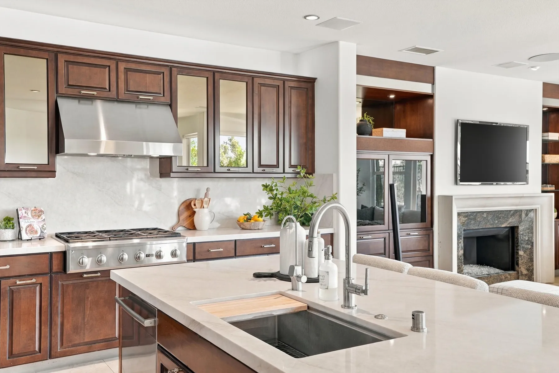 Kitchen island with quartz counters and six-burner range
