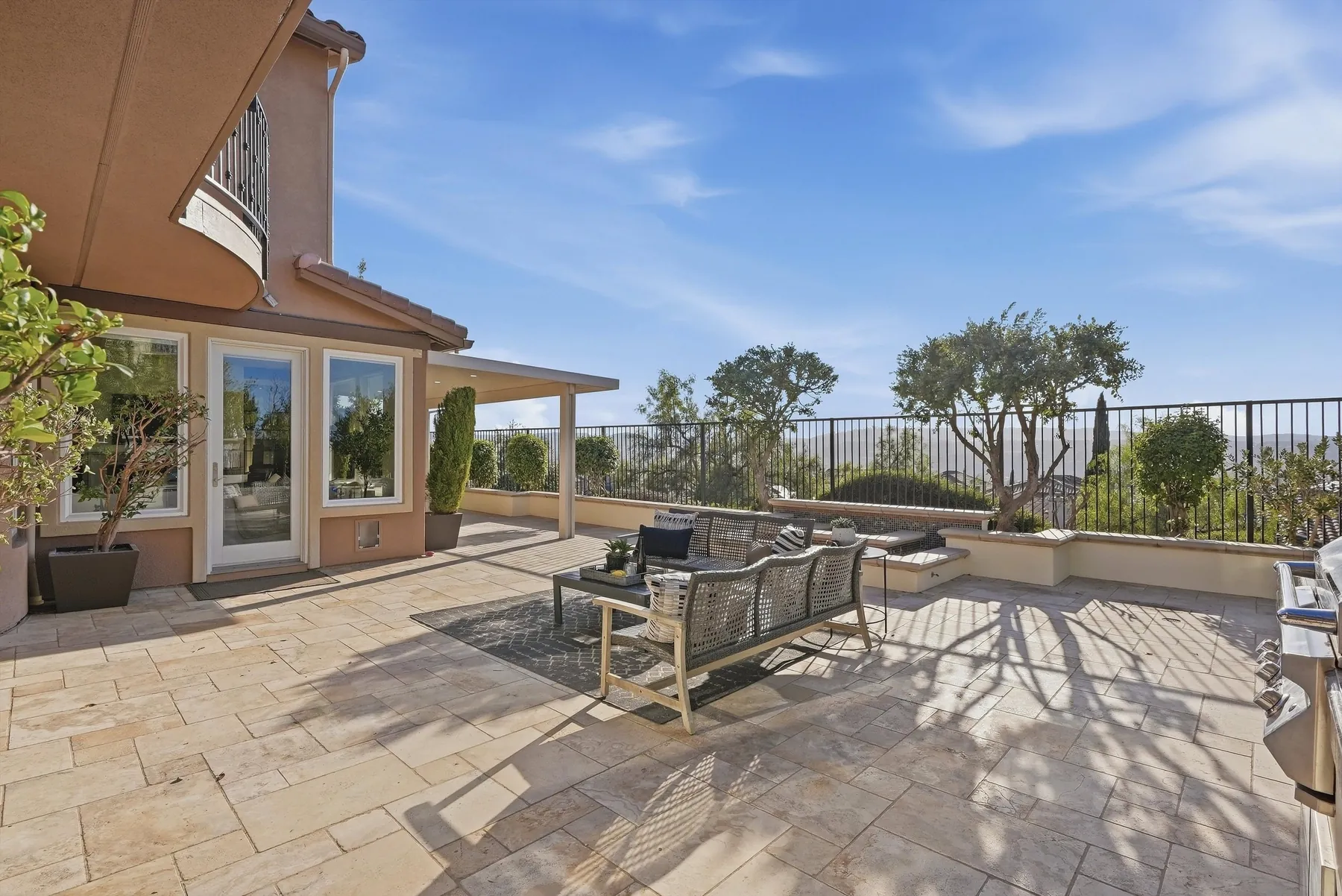 Stone patio with lounge seating and view