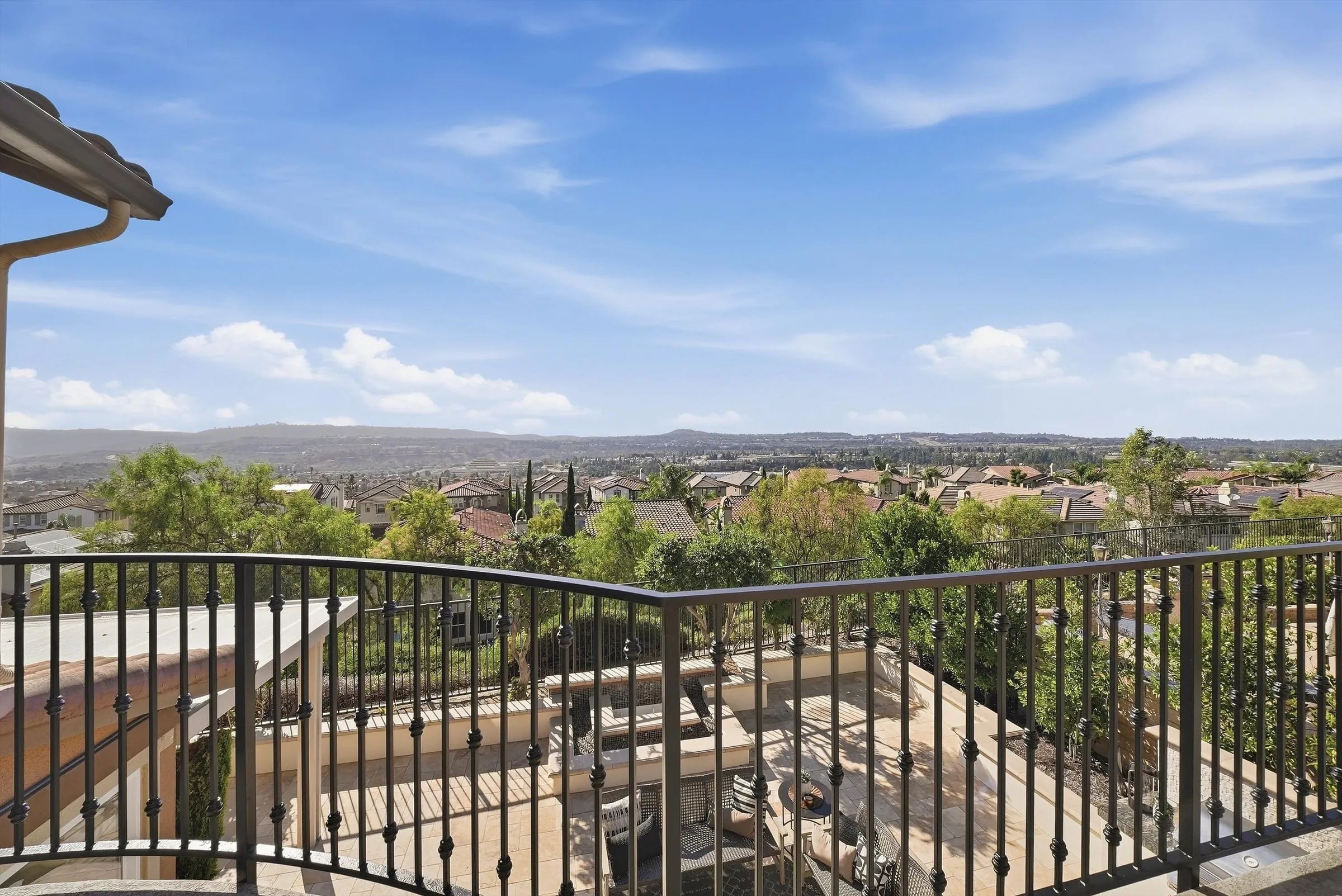 Panoramic view over Laguna Niguel to the mountains from the primary suite balcony