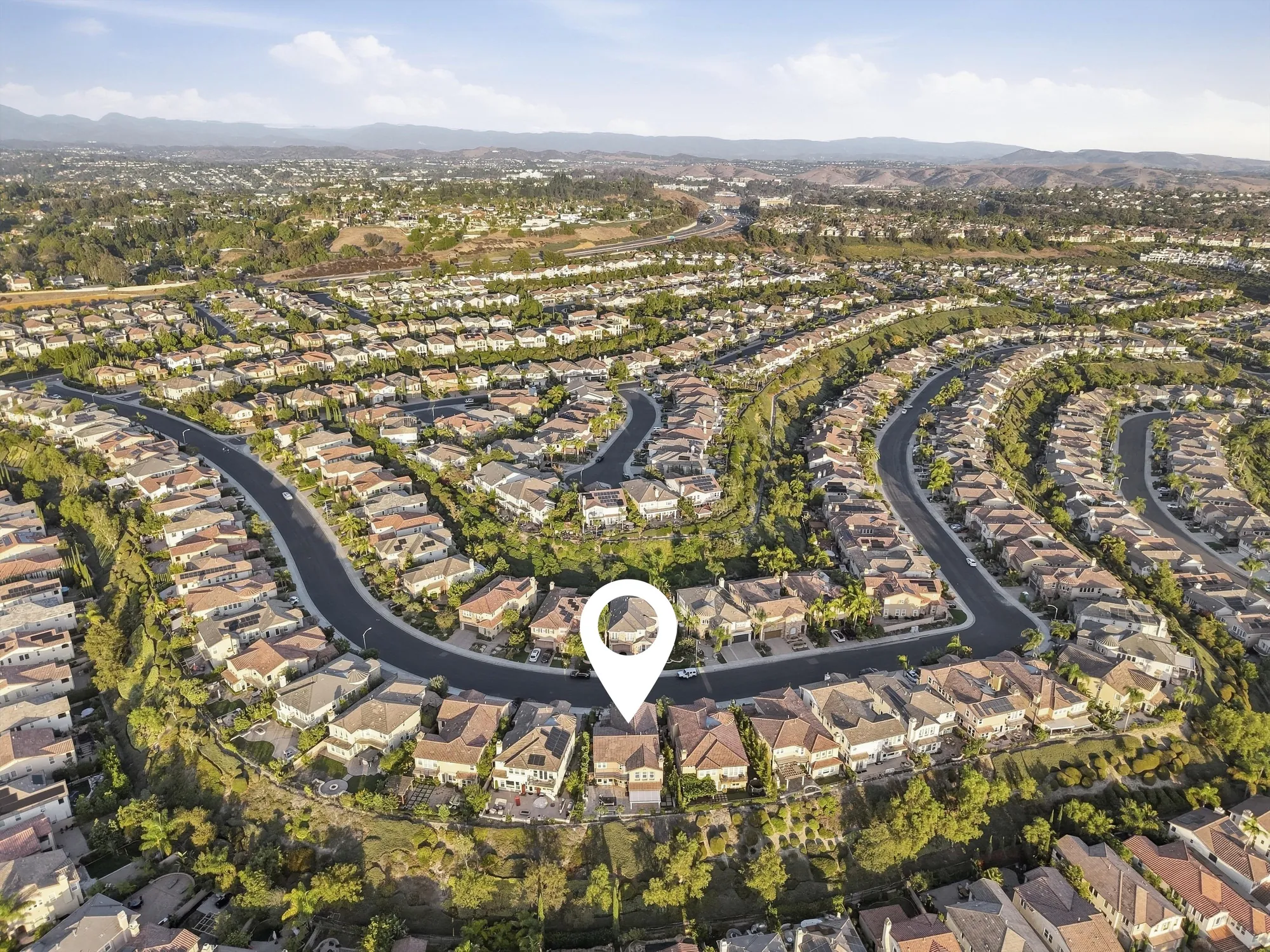 Aerial view of San Joaquin Hills with the home's location marked